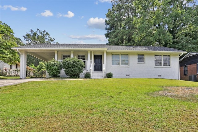 single story home with an attached carport, a front yard, concrete driveway, crawl space, and brick siding