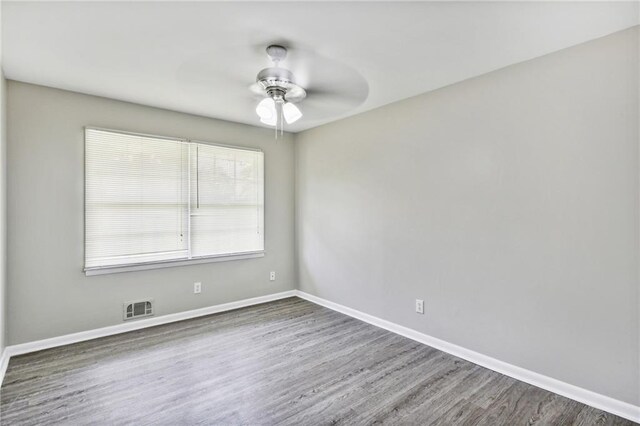 spare room featuring ceiling fan and wood-type flooring