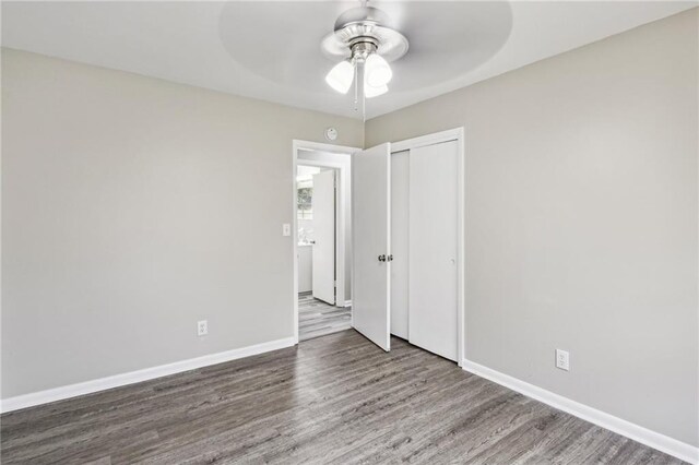 empty room featuring hardwood / wood-style floors and ceiling fan