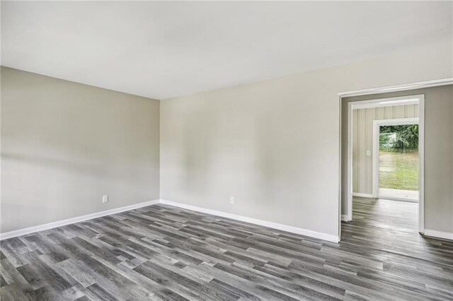 empty room featuring dark wood-type flooring