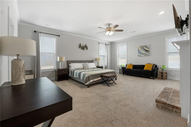 carpeted bedroom featuring multiple windows, baseboards, visible vents, and ornamental molding