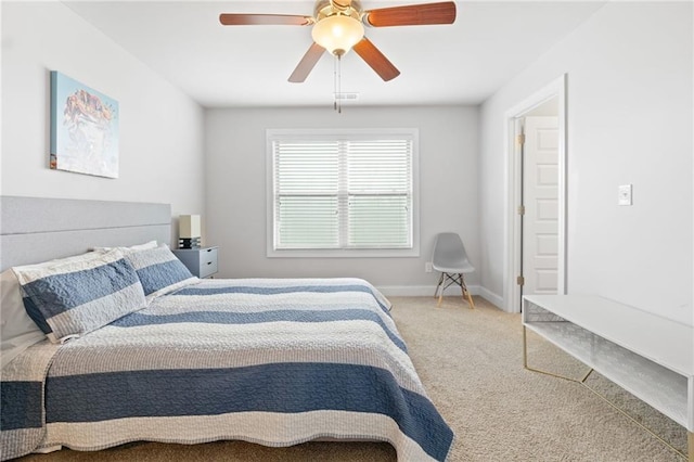 bedroom featuring ceiling fan, baseboards, and carpet floors