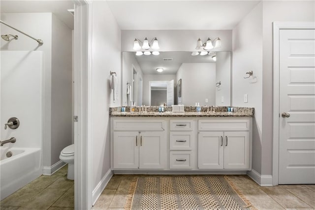 full bath with tile patterned floors, shower / washtub combination, toilet, and a sink