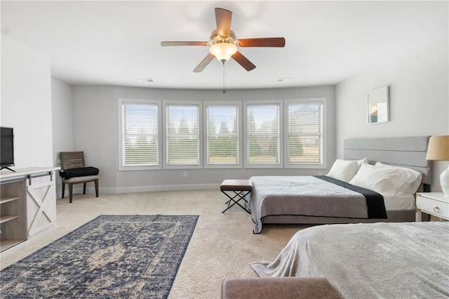 bedroom featuring a ceiling fan, visible vents, carpet, and baseboards