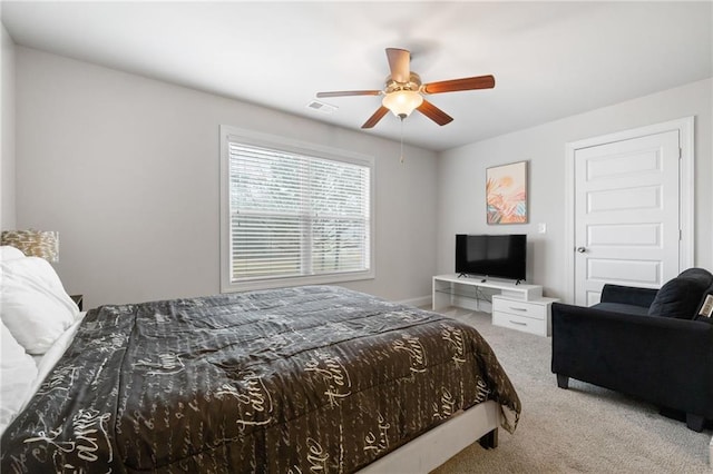 bedroom with visible vents, carpet floors, and a ceiling fan