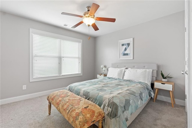 bedroom featuring carpet flooring, baseboards, visible vents, and ceiling fan