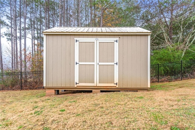 view of shed with a fenced backyard