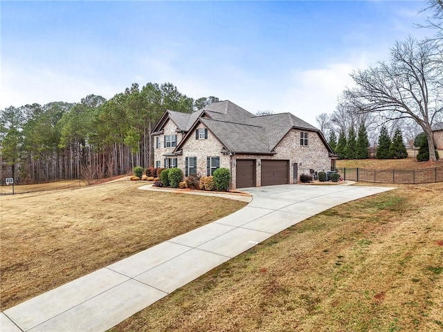 french country inspired facade featuring stone siding, concrete driveway, a front lawn, and fence