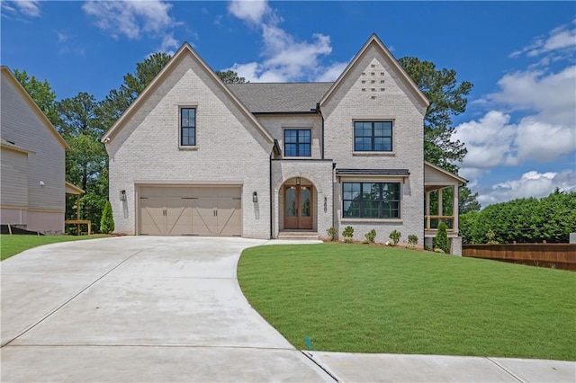 380 Hillcrest View Dr, Suwanee, GA 30024 - view of front of home with an attached garage, brick siding, concrete driveway, and a front yard