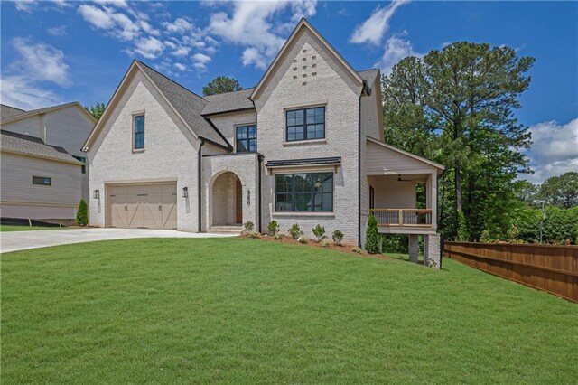 380 Hillcrest View Dr, Suwanee, GA 30024 - french country inspired facade with a garage, brick siding, driveway, and a balcony