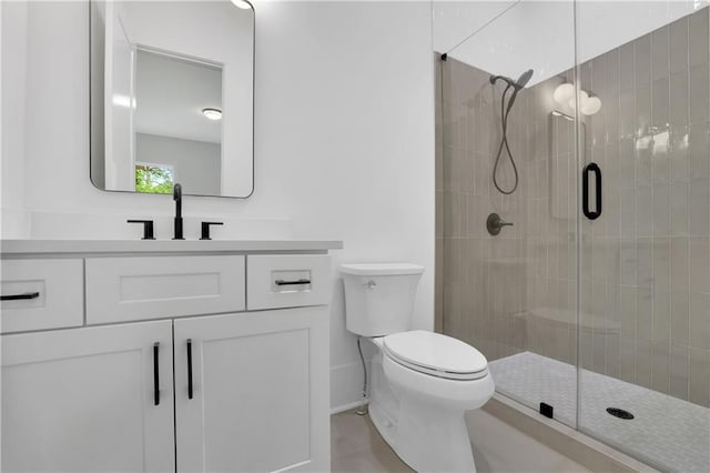 380 Hillcrest View Dr, Suwanee, GA 30024 - full bath featuring a stall shower, toilet, vanity, baseboards, and tile patterned floors