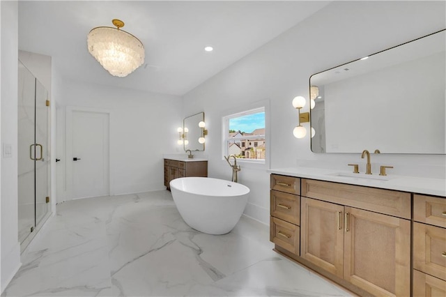 380 Hillcrest View Dr, Suwanee, GA 30024 - bathroom with a shower stall, two vanities, a freestanding tub, marble finish flooring, and recessed lighting