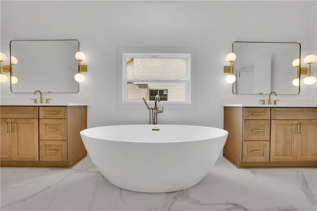 380 Hillcrest View Dr, Suwanee, GA 30024 - bathroom featuring marble finish floors, two vanities, and a freestanding tub