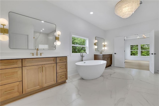 380 Hillcrest View Dr, Suwanee, GA 30024 - full bath with plenty of natural light, marble finish floors, two vanities, and recessed lighting