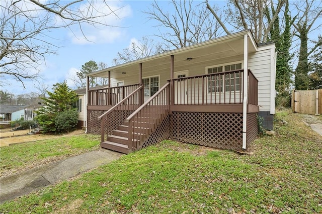 view of front of house with a porch and a front yard