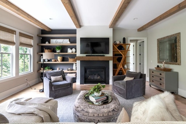 living room with beam ceiling and hardwood / wood-style floors