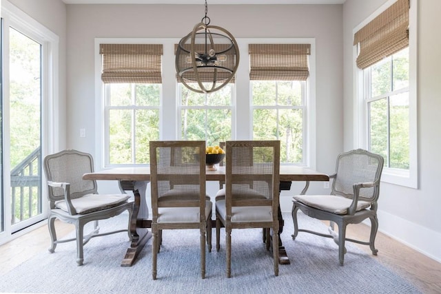 dining area featuring an inviting chandelier