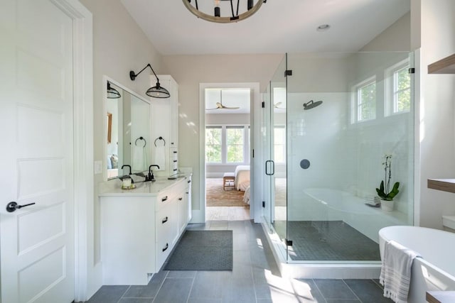 bathroom with walk in shower, tile patterned floors, and vanity