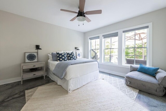 bedroom featuring ceiling fan and light colored carpet