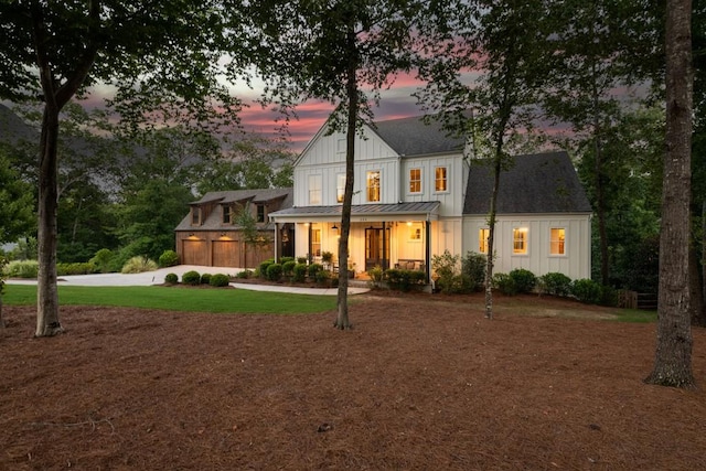 view of front of home featuring a lawn and covered porch