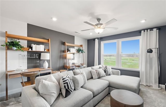 carpeted living room featuring ceiling fan