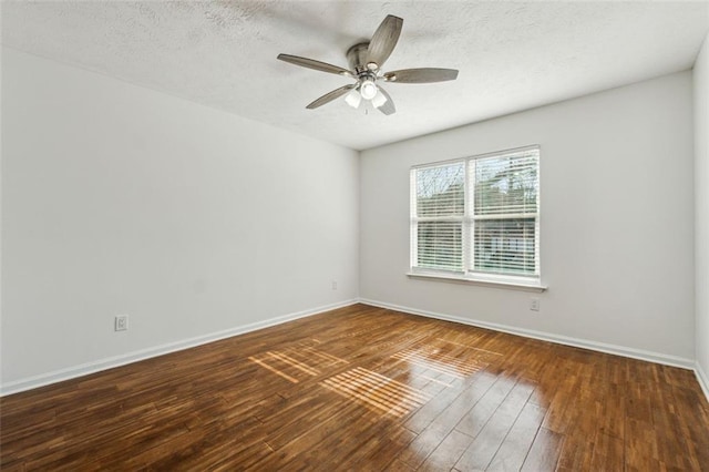 unfurnished room with ceiling fan, dark hardwood / wood-style floors, and a textured ceiling