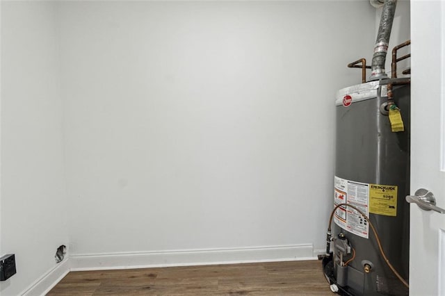 utility room featuring water heater