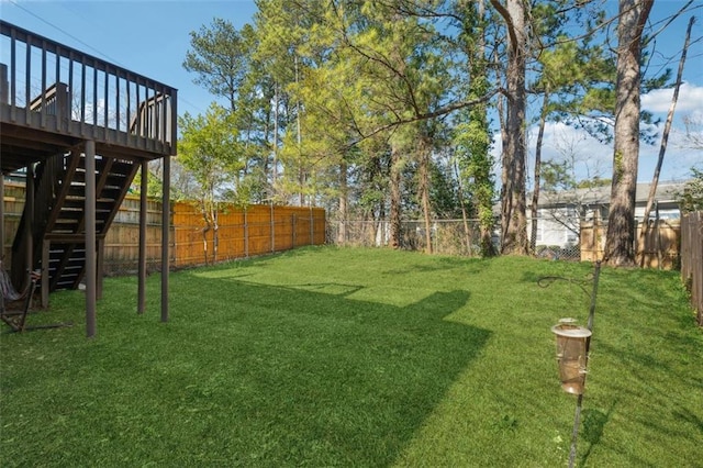 view of yard featuring a wooden deck