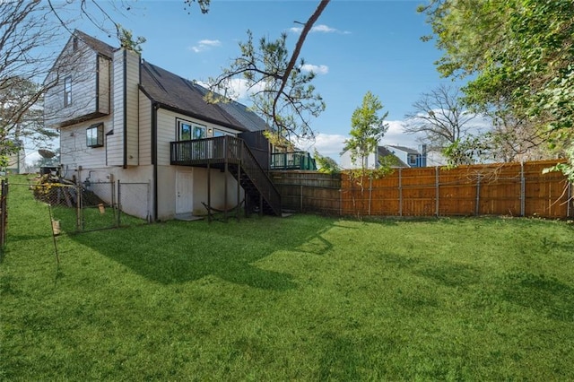 view of yard featuring a wooden deck