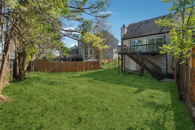 view of yard featuring a deck