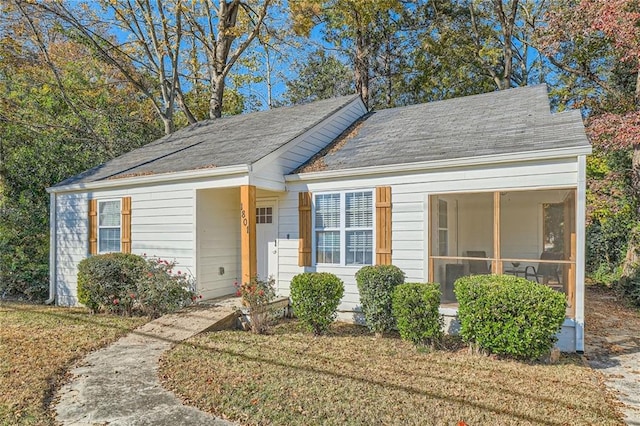 view of front of property with a sunroom