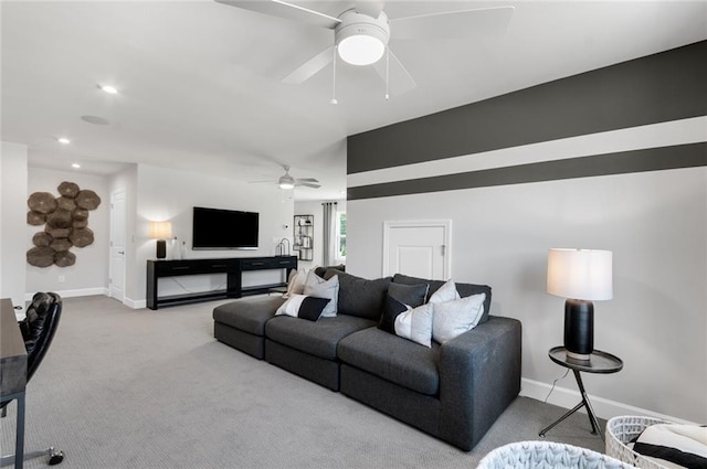 living room with light colored carpet and ceiling fan