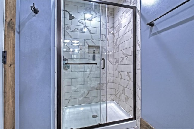 bathroom featuring a shower stall