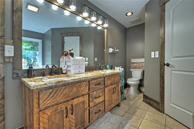 full bathroom featuring tile patterned flooring, toilet, a sink, visible vents, and double vanity