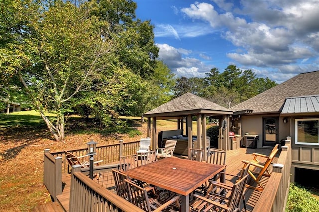 wooden deck featuring a gazebo and outdoor dining area