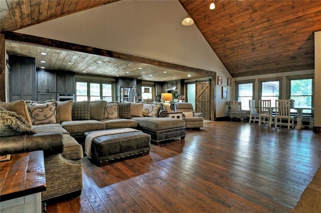 living area featuring a healthy amount of sunlight, wood-type flooring, wooden ceiling, and a barn door