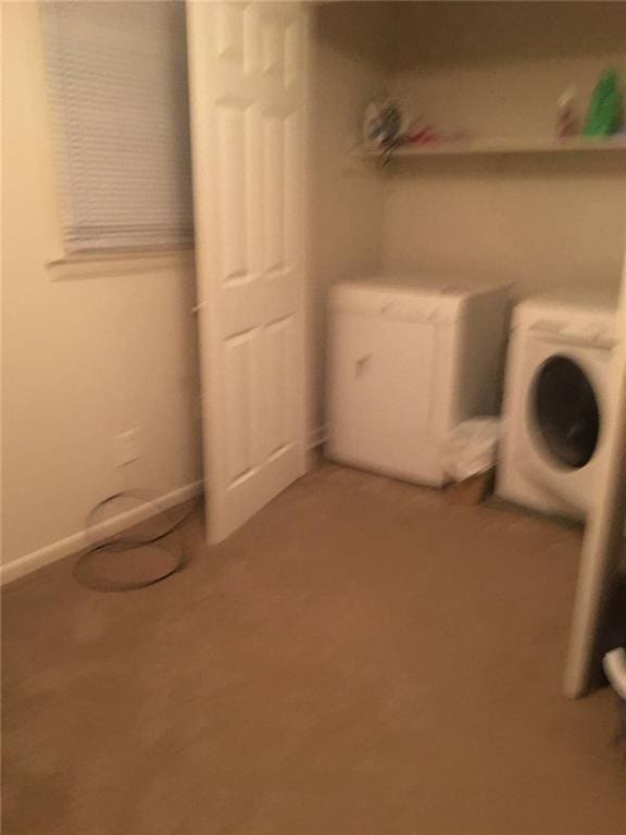 clothes washing area with separate washer and dryer