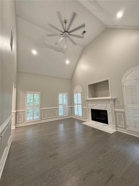255 Carriage Station Dr, Lawrenceville, GA 30046 - unfurnished living room featuring high vaulted ceiling, a decorative wall, a ceiling fan, a premium fireplace, and dark wood-style flooring