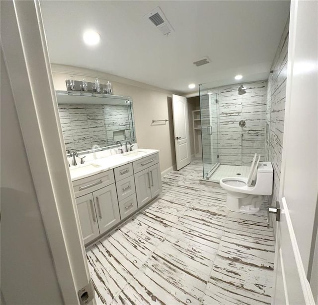 255 Carriage Station Dr, Lawrenceville, GA 30046 - bathroom with a stall shower, double vanity, recessed lighting, toilet, and crown molding