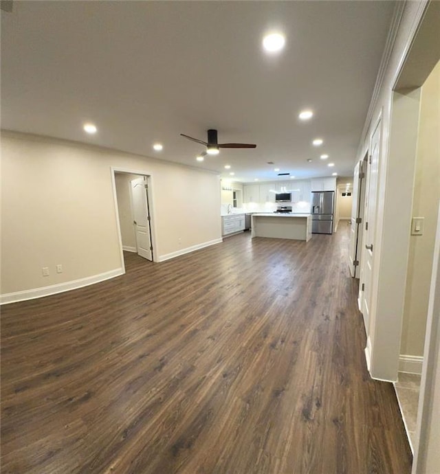 255 Carriage Station Dr, Lawrenceville, GA 30046 - unfurnished living room featuring recessed lighting, dark wood-type flooring, ceiling fan, and baseboards