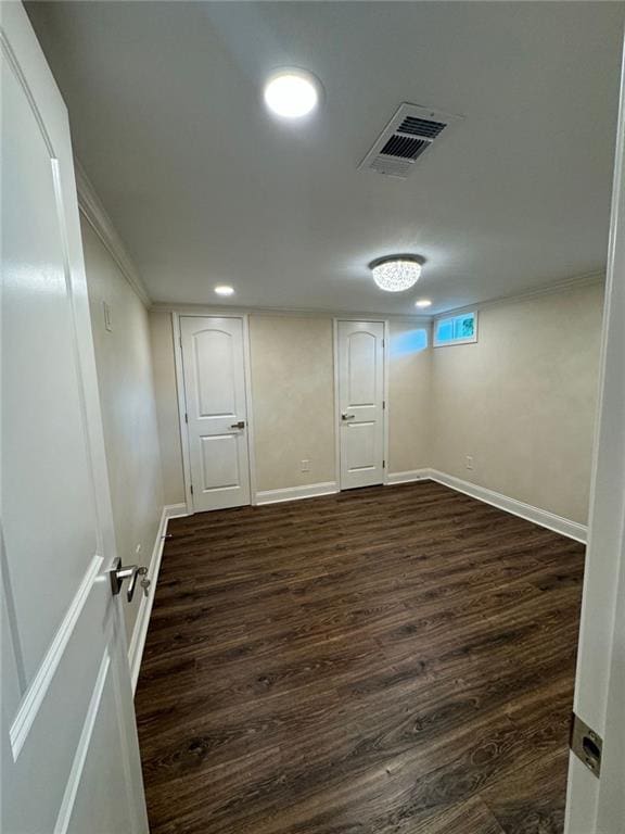 255 Carriage Station Dr, Lawrenceville, GA 30046 - basement with dark wood-style flooring, baseboards, ornamental molding, and recessed lighting