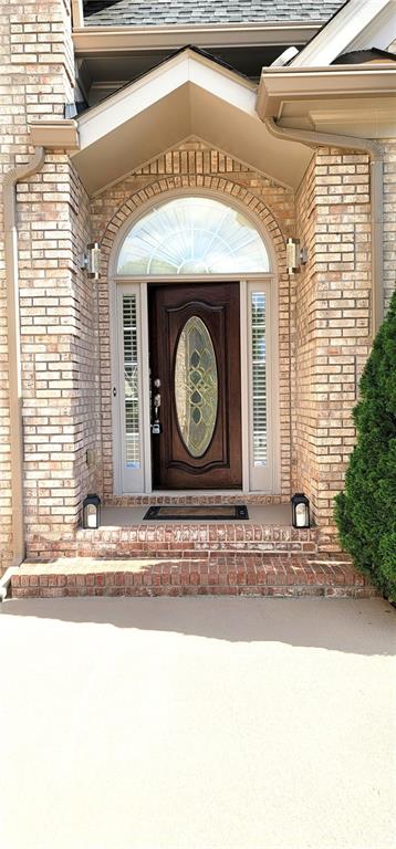 255 Carriage Station Dr, Lawrenceville, GA 30046 - view of exterior entry with brick siding