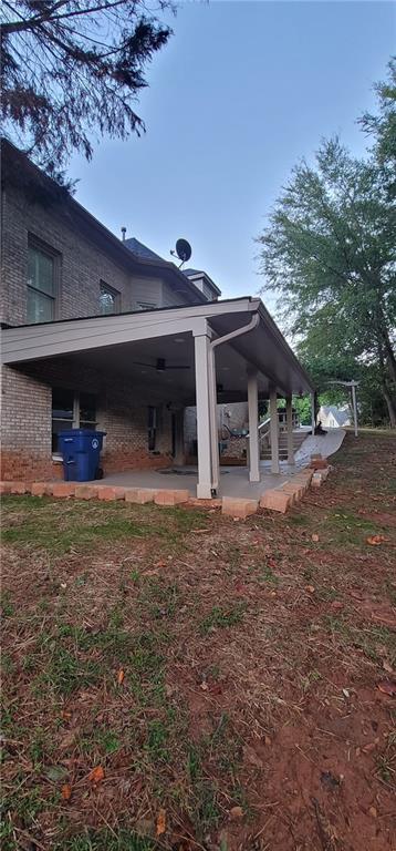 255 Carriage Station Dr, Lawrenceville, GA 30046 - rear view of property featuring brick siding