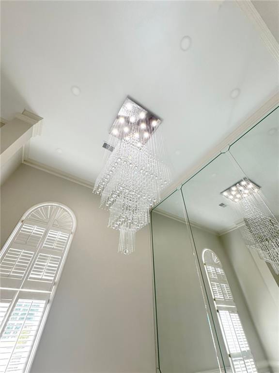 255 Carriage Station Dr, Lawrenceville, GA 30046 - detailed view of a chandelier and crown molding