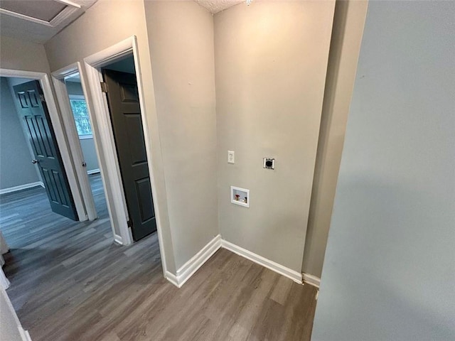 2489 Hillside Dr, Macon, GA 31206 - washroom with hookup for an electric dryer, wood finished floors, baseboards, and hookup for a washing machine