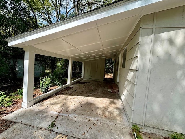 2489 Hillside Dr, Macon, GA 31206 - view of patio with a carport