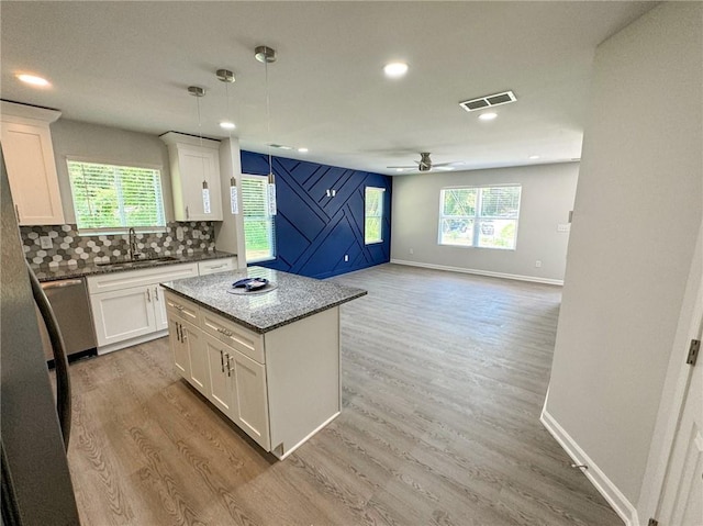 1351 E Atlanta Rd E, Stockbridge, GA 30281 - kitchen with a sink, stainless steel dishwasher, a ceiling fan, white cabinets, and recessed lighting