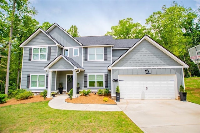view of front facade featuring a garage, board and batten siding, concrete driveway, and a front yard