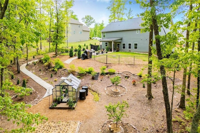 rear view of property with fence