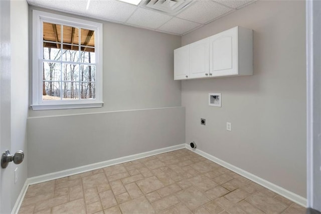 washroom featuring washer hookup, cabinet space, electric dryer hookup, and baseboards